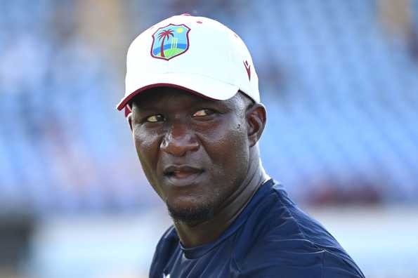Daren Sammy questions umpire's decisions.