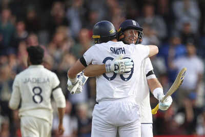 Root and Smith celebrate England's victory