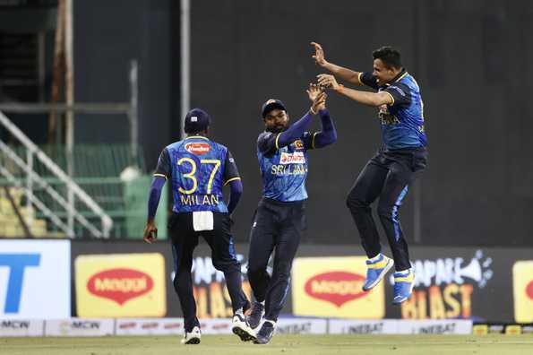 Sri Lankan fielders celebrate a crucial moment.